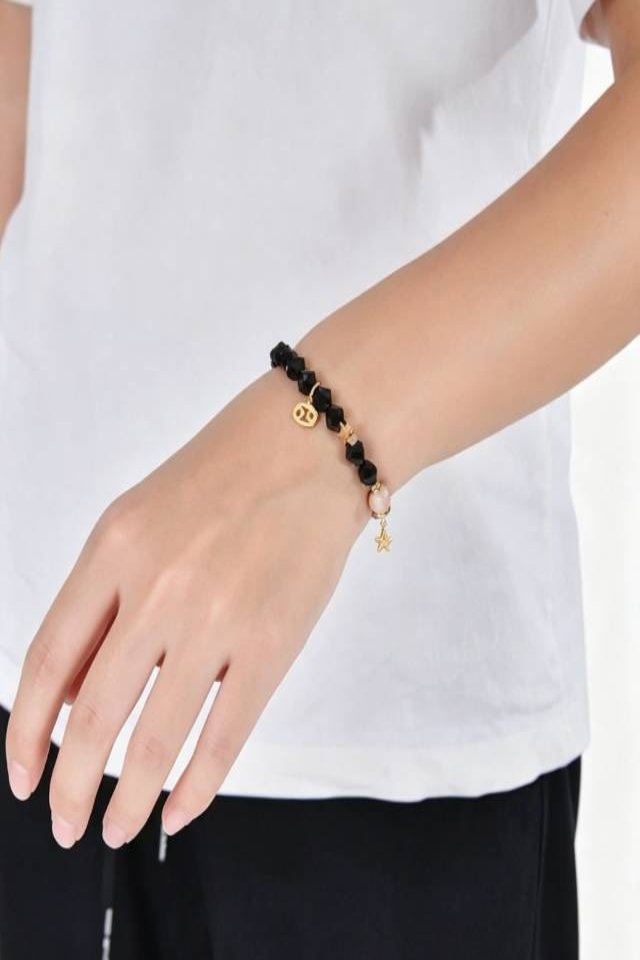 Black beaded bracelet on wrist Celestial Zodiac Obsidian Bracelet - Image 2